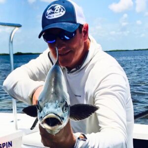 John Candee holding a fish